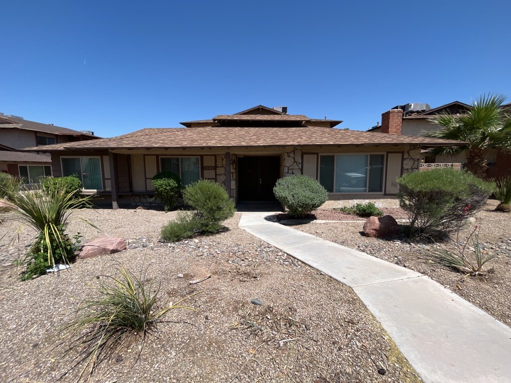 Charming fourplex with spacious units, garages, patios, and location property image