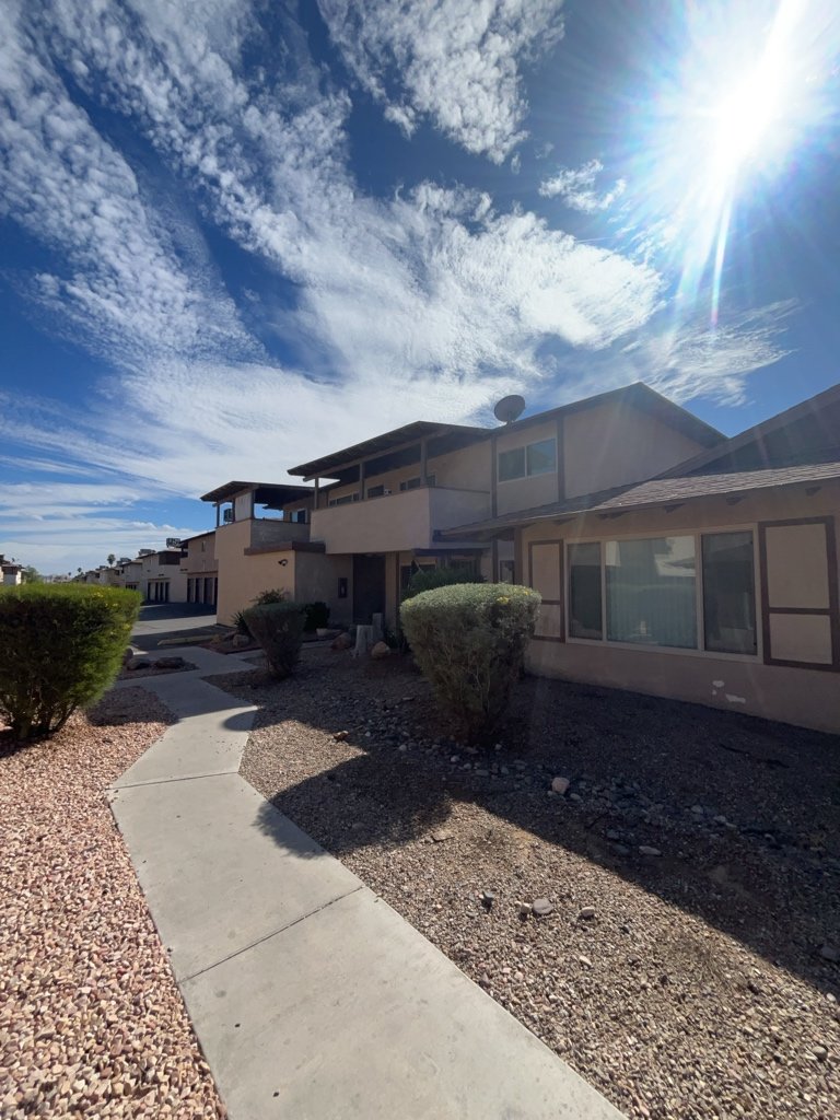 Charming fourplex with spacious units, garages, patios, and location property image