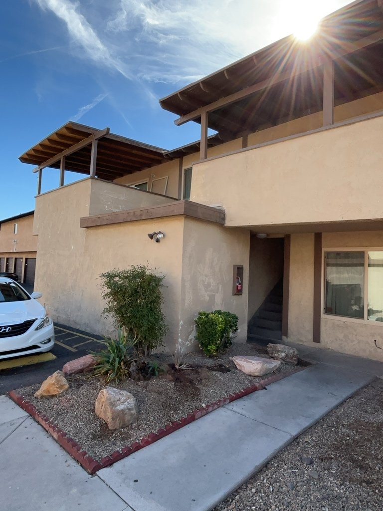 Charming fourplex with spacious units, garages, patios, and location property image