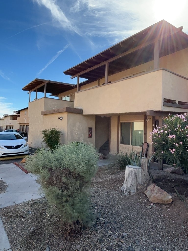 Charming fourplex with spacious units, garages, patios, and location property image