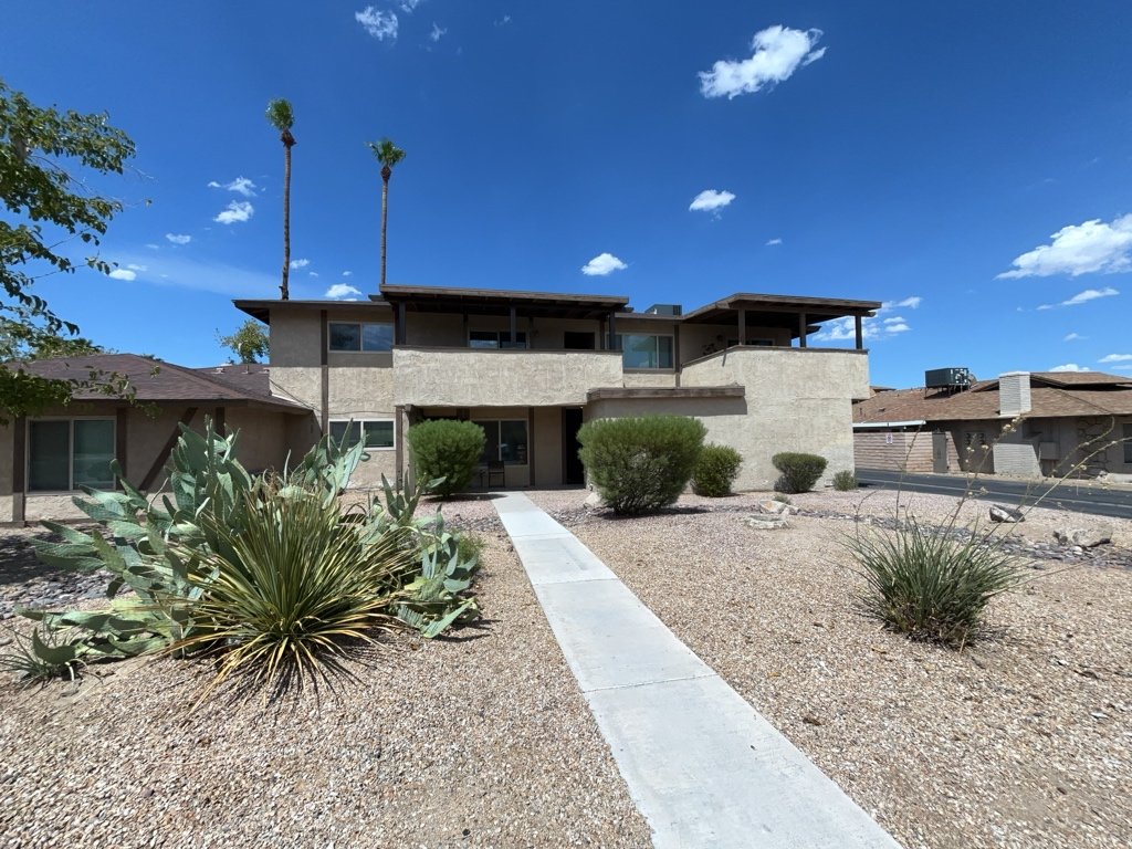 Centrally located fourplex with garages, patios, and long-term tenants. property image
