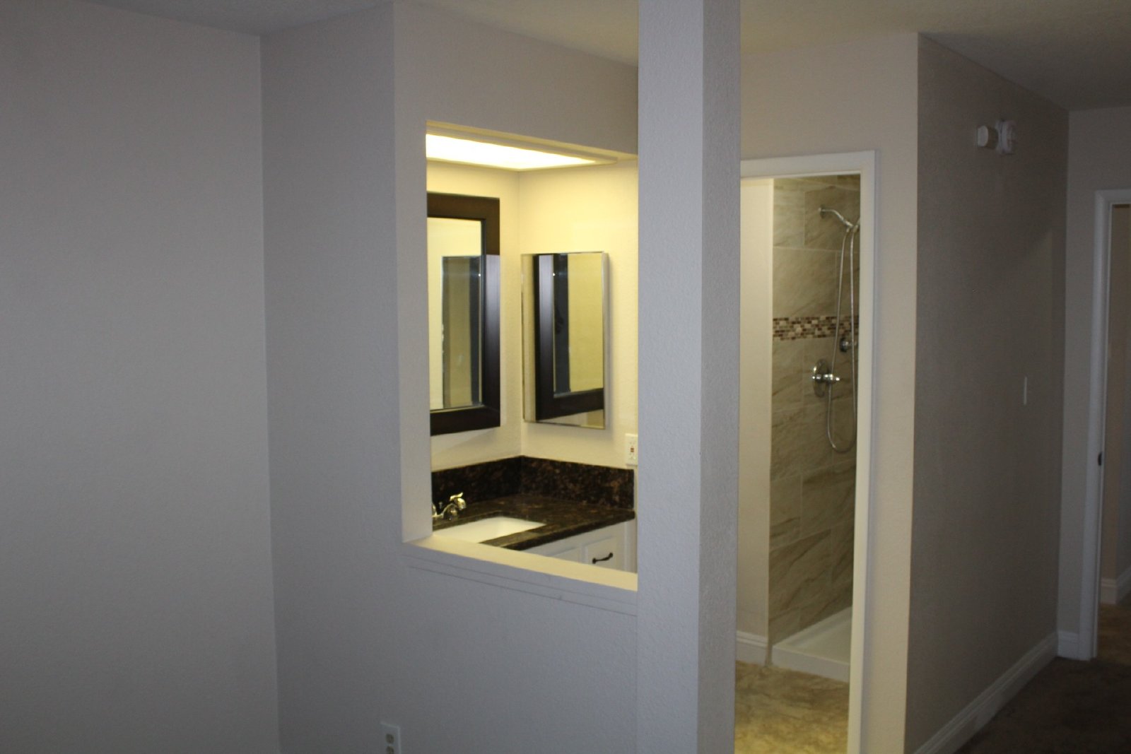 Single-story home with patio and garage property image