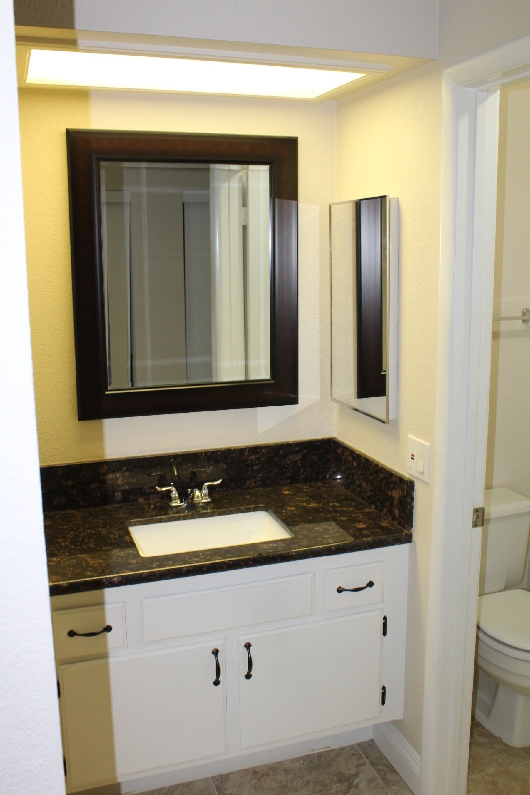 Single-story home with patio and garage property image