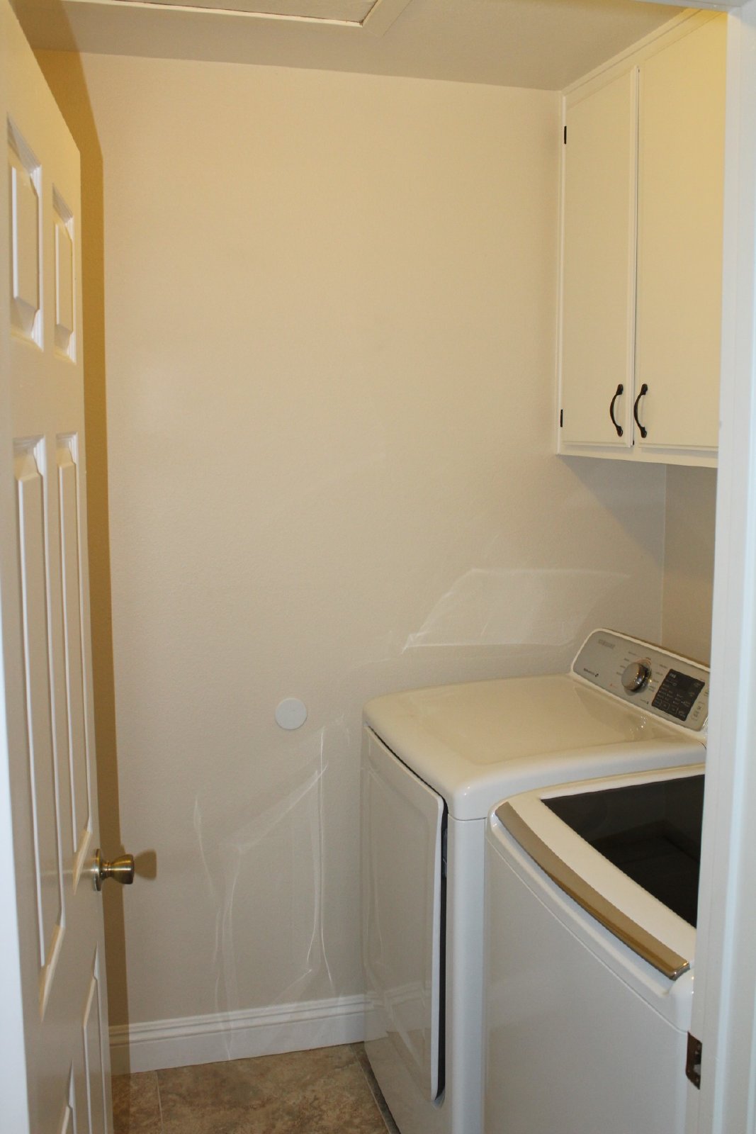 Single-story home with patio and garage property image