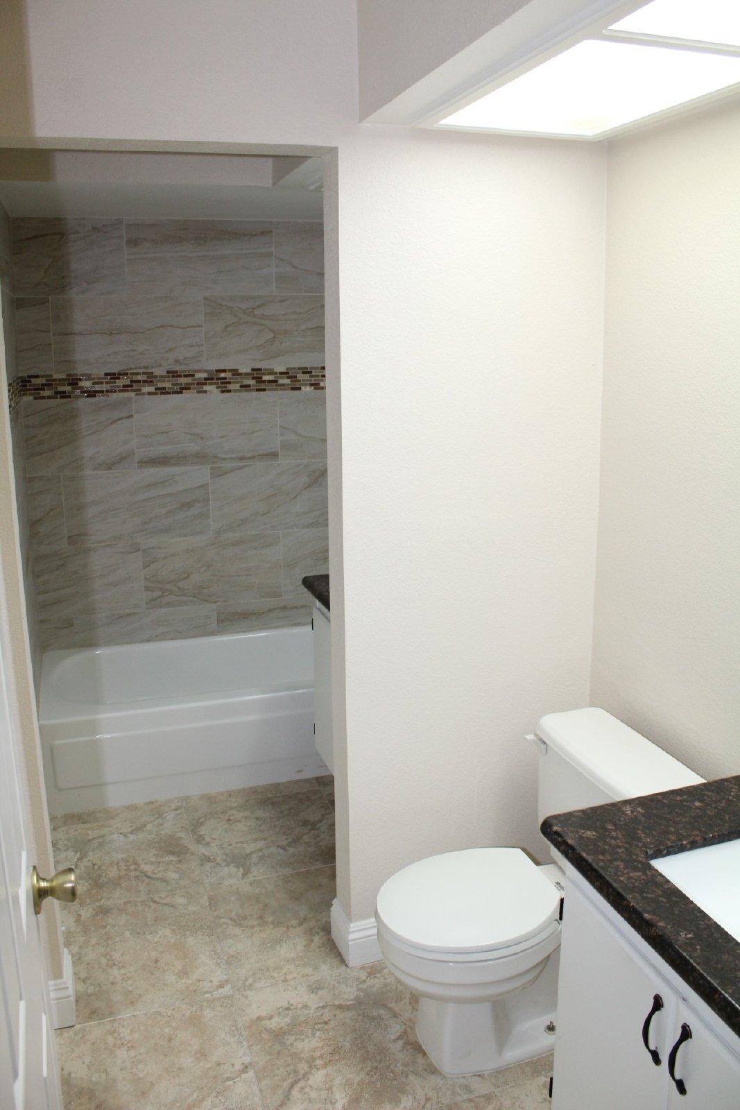 Single-story home with patio and garage property image